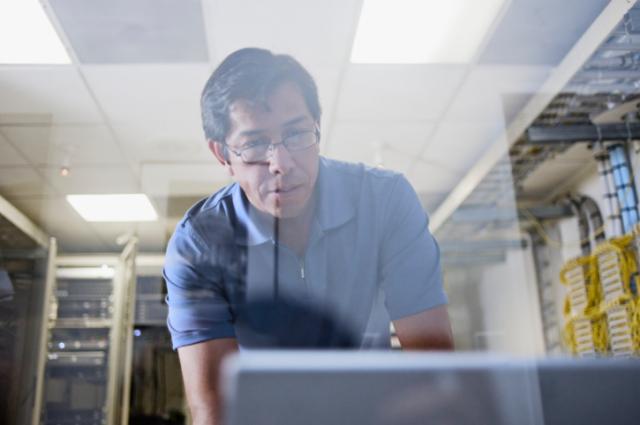 man_working_on_computer_in_data_center_w640.jpeg